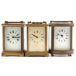 French oval brass cased carriage clock, and two others,