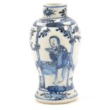 A Chinese blue and white vase, decorated with figures in a garden.