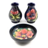 Moorcroft Pottery pair of Anemone pattern vases, and a Clematis pattern bowl.