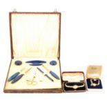 Miniature brass quartz clocks, wrist watches, simulated pearl necklaces and part manicure set.