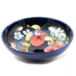 A Moorcroft Pottery pedestal bowl, 'Frilled and Slipper Orchid' design.
