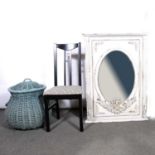Single ebonised chair, modern wall mirror, and a wicker laundry basket