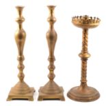 Pair brass candlesticks and another Gothic style gilt metal candlestick