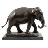 A hollow cast patinated model of a bull elephant