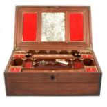 A mahogany multi-compartment jewellery box with brass inlays,