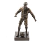 Patinated art metal sculpture of a 1930s footballer