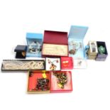 A collection of modern costume jewellery in branded boxes.