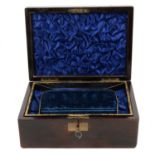 A mahogany jewel box with two fitted lift out trays and key.
