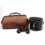 Leather Gladstone bag; and a pair of Lieberman 8x40 binoculars.