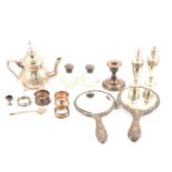 Two silver-backed hand mirrors; four silver napkin rings; dwarf candlestick etc