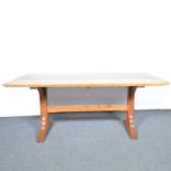 An Arts & Crafts oak dining table