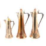 WMF, pair of large silvered metal wine jugs, and a smaller claret jug