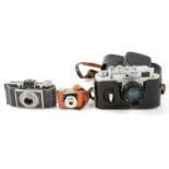 Mixed vintage cameras and accessories, one tray including Zorki-4K and miniature cameras.