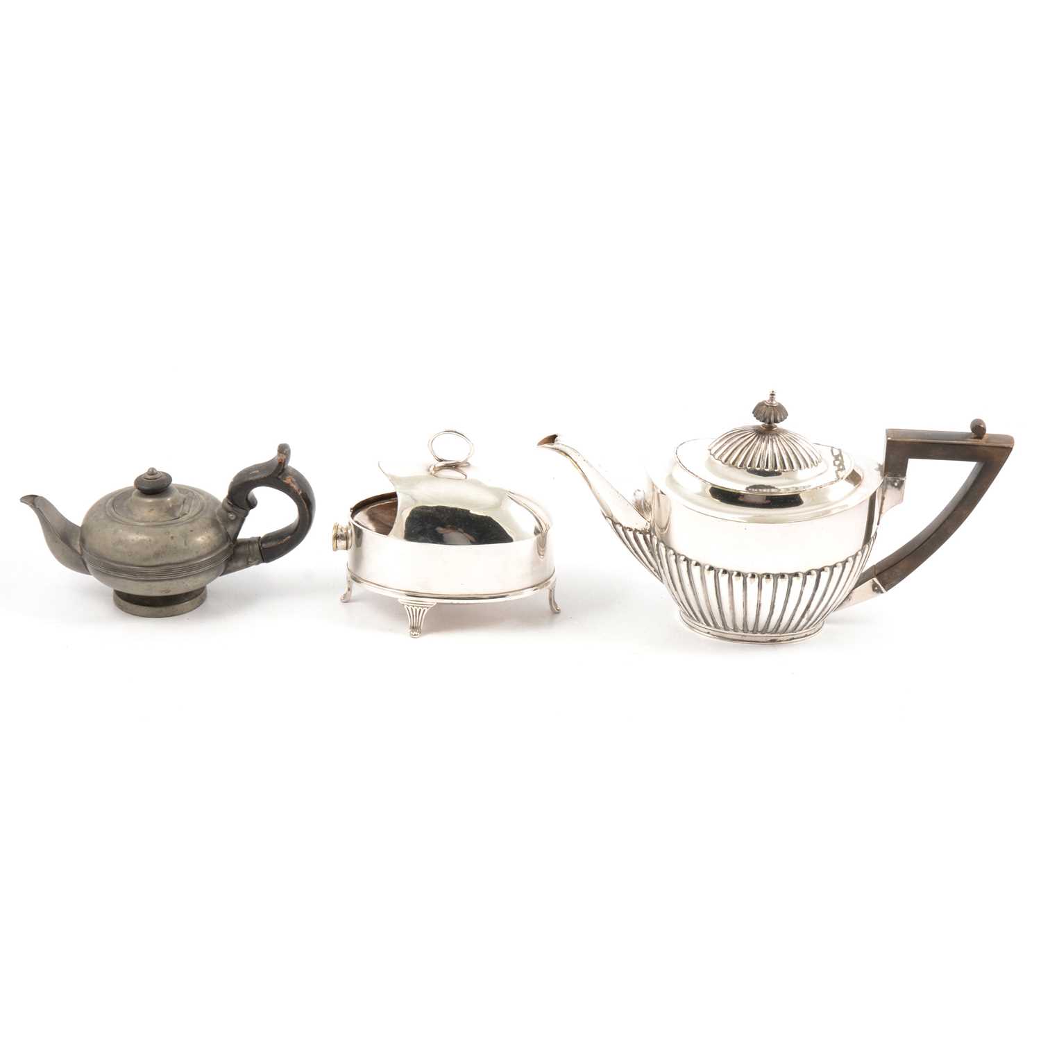 Silver-plated teapot, entree dishes, spoon warmer, cutlery and small pewter teapot.