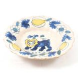 English Delft bowl, hand-painted with a lion,