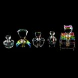 Five iridescent cut glass scent bottles.