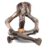 Tribal Art - A large seated Congo seated figure, water carrier and other figures.