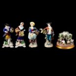 Four Continental porcelain figures, and a Dresden style posy holder