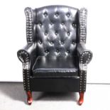 Wing back easy chair, simulated leather buttoned upholstery,