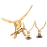 Three cast brass eagles, one large two small.