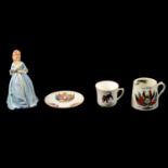 WW1 Victory mug, commemorative cup, commemorative saucer, and a Royal Worcester figurine.