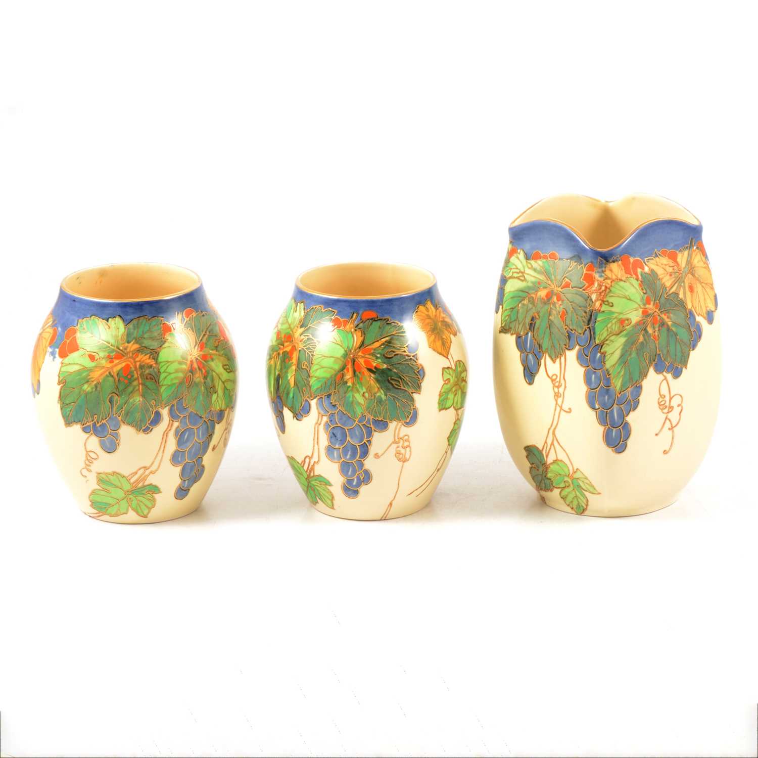 Pair of Royal Doulton ovoid vases and matching square section vase.