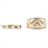 A diamond and green stone half hoop ring and a diamond and green stone eternity ring.