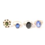 Four blue and green stone dress rings.