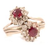 A ruby and diamond double cluster ring.