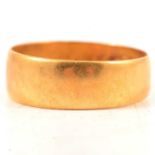 A 22 carat yellow gold wedding band.