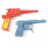 Two toys guns, including Captain Scarlet, red body; Lone Star, blue body.