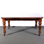 Victorian mahogany extending dining table, with two additional leaves