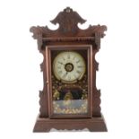 An American stained wood automatic alarm shelf clock by Jerome & Co.