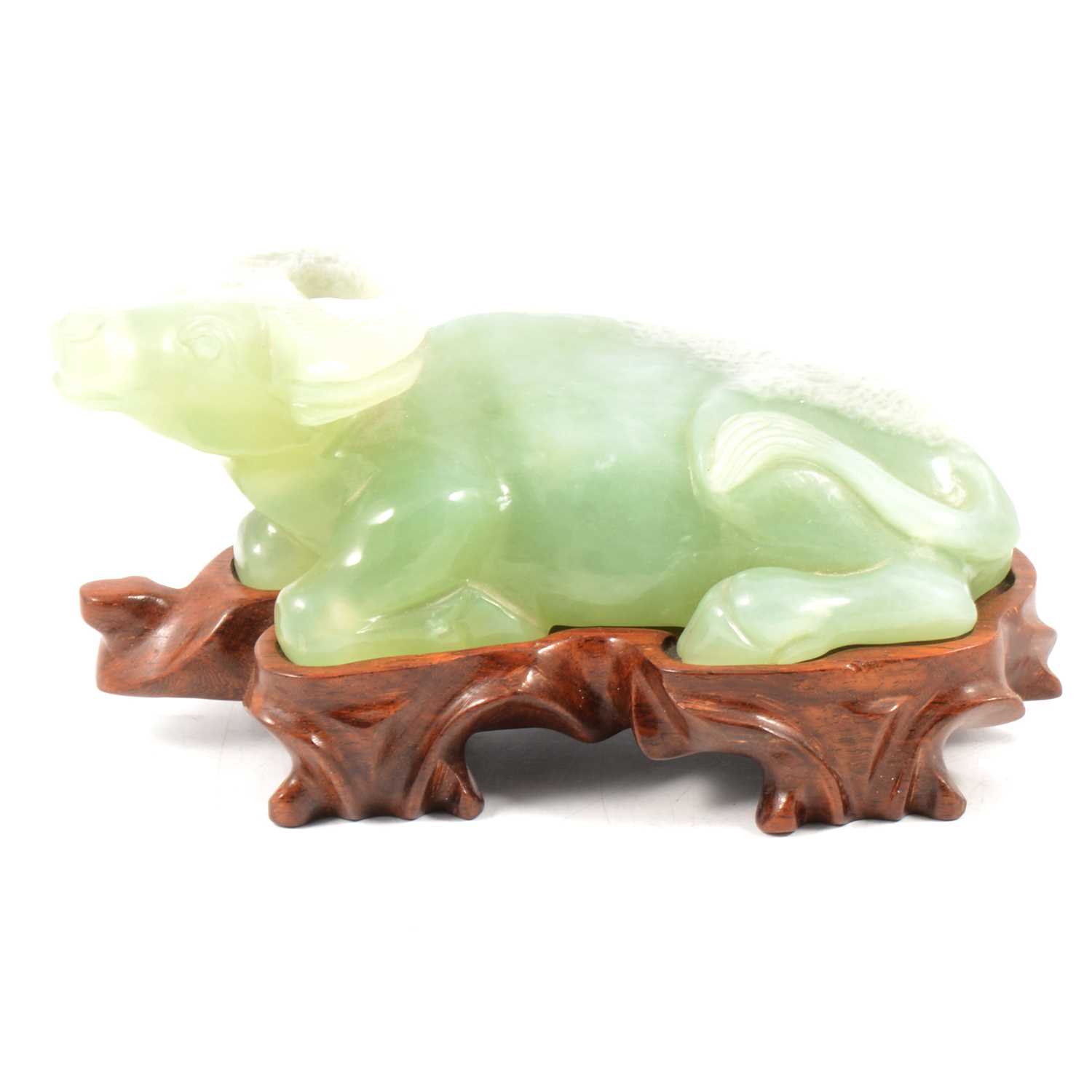 Chinese carved Jade-style figure of a reclining water buffalo, on stand