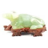 Chinese carved Jade-style figure of a reclining water buffalo, on stand