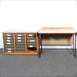 Modern beech chest with plastic drawers, and an industrial desk.