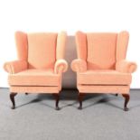 Two modern wing-back armchairs