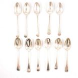 Eleven Old English pattern silver table spoons