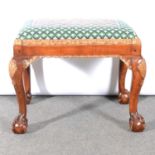 A George I style walnut and parcel gilt stool