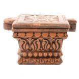 A carved walnut spice box