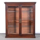 A mahogany and walnut banded bookcase