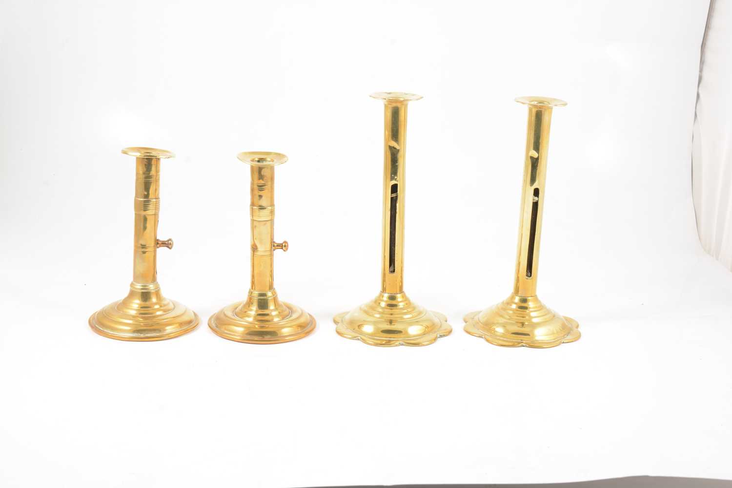 A pair of tall George III brass push-up candlesticks, and another pair - Image 2 of 4