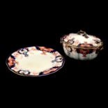 Thirteen Royal Crown Derby Imari pattern dinner plates and a lidded tureen.