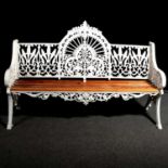 Coalbrookdale style cast metal garden bench and two tables,