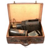 A Victorian Magic lantern, in vintage suitcase.