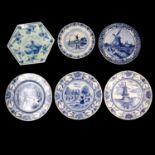 Six various Delft pottery plates, and an Italian pottery plate, similarly decorated.