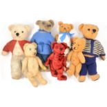 Teddy bears, seven vintage and others, all apart from one with jointed limbs.