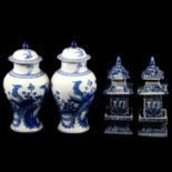 Pair of Chinese blue and white covered vases, and a pair of pagoda vases,