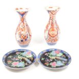 Pair of Japanese Imari vases, and a pair of famille noir plates,