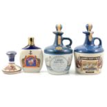 Two Lamb's Navy Rum stoneware flagon, and two other rum flasks